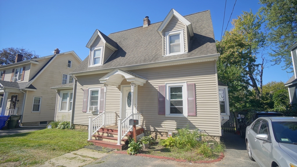 26 Harkness Avenue Springfield, MA 01118 - Photo 3 of 25 a front view of a house with a garden