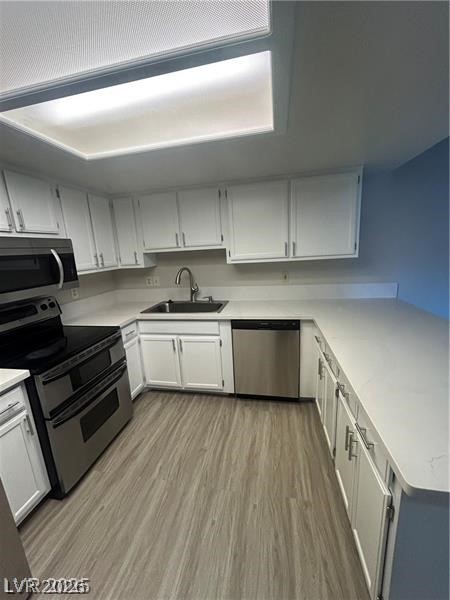 9070 Spring Mountain Road, Unit 210 Las Vegas, NV 89117 - Photo 5 of 12 This modern kitchen features stainless steel appliances and ample counter space, perfect for everyday living.