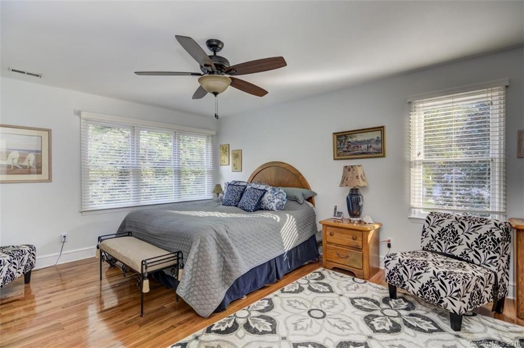 5204 Fowler Farm Road Mint Hill, NC 28227 - Photo 16 of 28 a bedroom with a bed and wooden floor