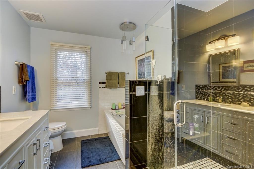 5204 Fowler Farm Road Mint Hill, NC 28227 - Photo 17 of 28 a bathroom with a granite countertop sink toilet and shower