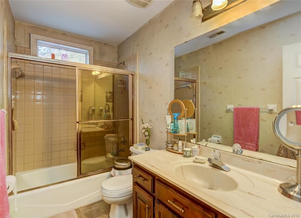 5204 Fowler Farm Road Mint Hill, NC 28227 - Photo 18 of 28 a bathroom with a sink toilet and shower