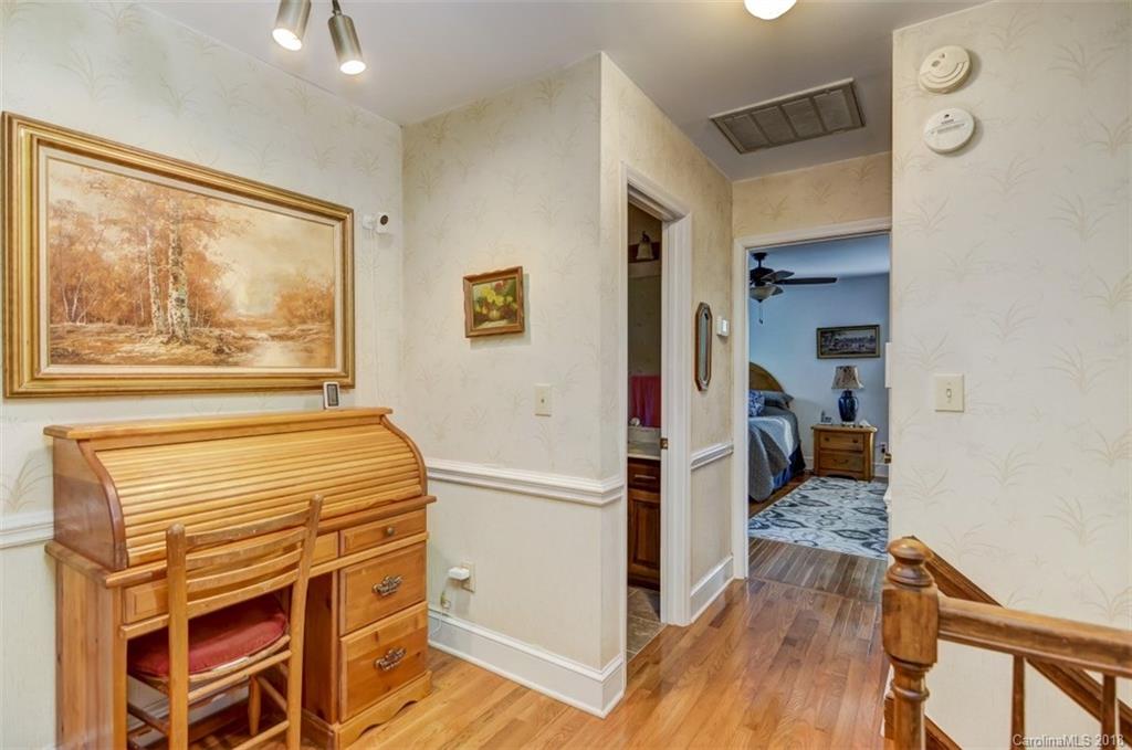 5204 Fowler Farm Road Mint Hill, NC 28227 - Photo 19 of 28 a view of a hallway with wooden floor and a cabinet