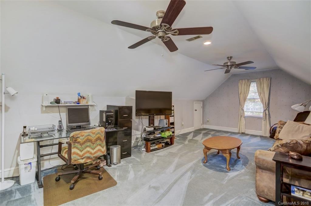 5204 Fowler Farm Road Mint Hill, NC 28227 - Photo 22 of 28 a living room with furniture and a flat screen tv