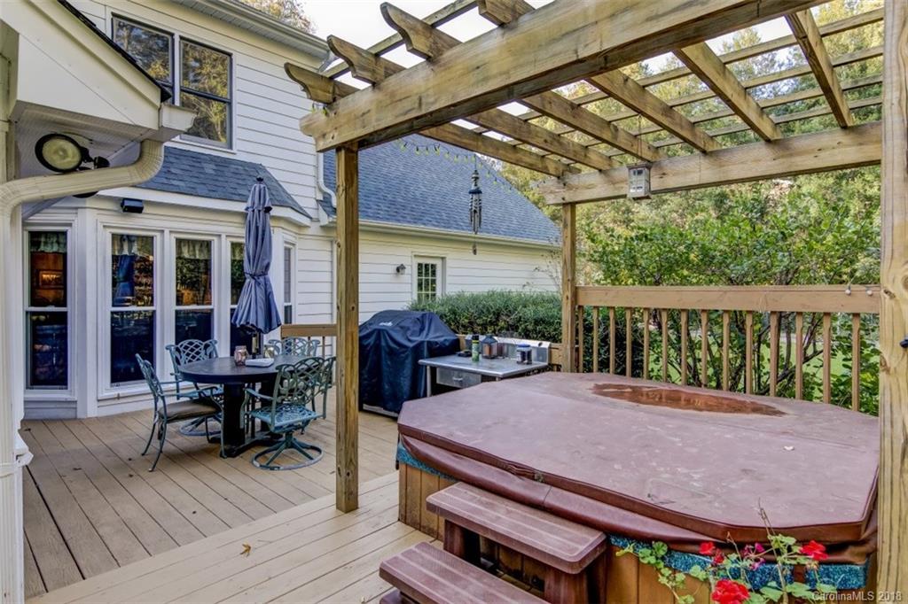 5204 Fowler Farm Road Mint Hill, NC 28227 - Photo 25 of 28 a view of a patio with table and chairs with wooden floor and fence