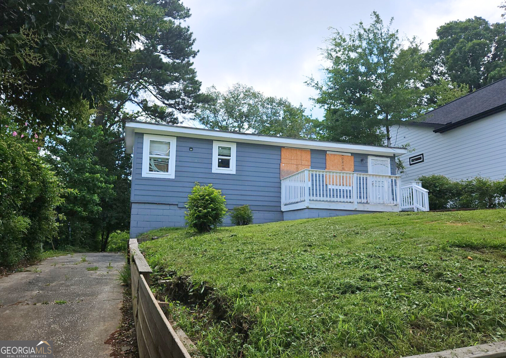 117 Dahlia Avenue Northwest Atlanta, GA 30314 - Photo 2 of 10 a backyard of a house with lots of green space