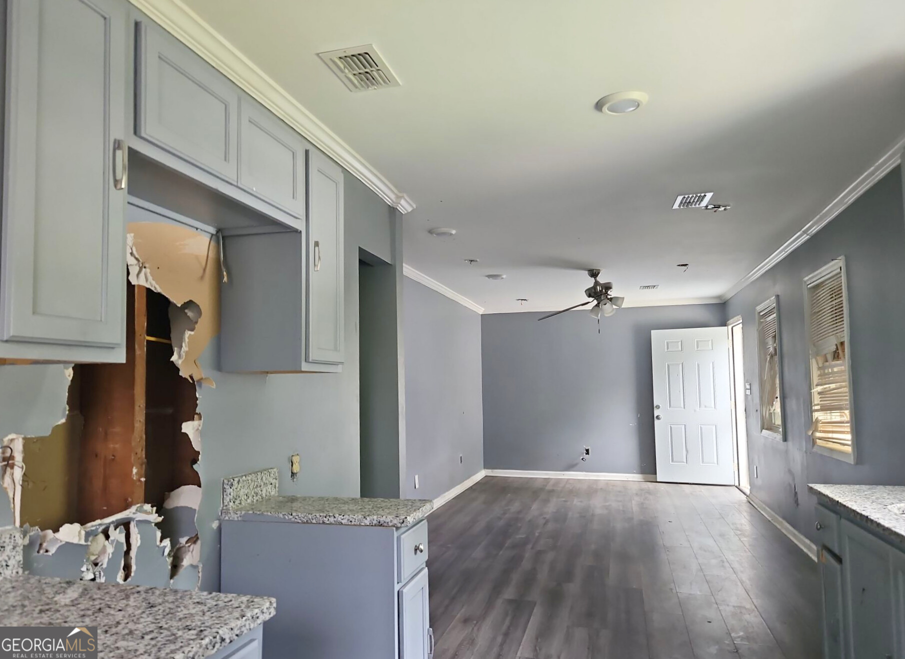 117 Dahlia Avenue Northwest Atlanta, GA 30314 - Photo 5 of 10 a open kitchen with granite countertop a sink cabinets and wooden floor