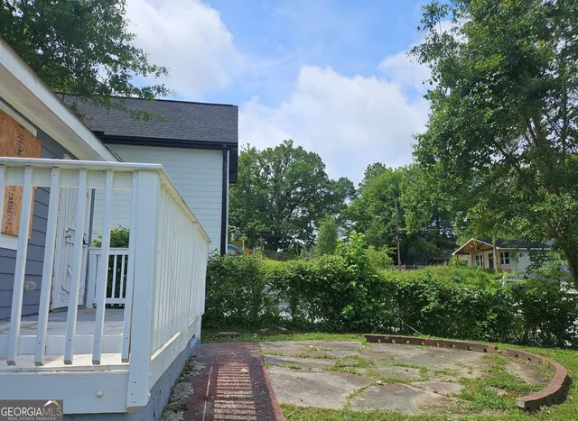 a backyard of a house with lots of green space