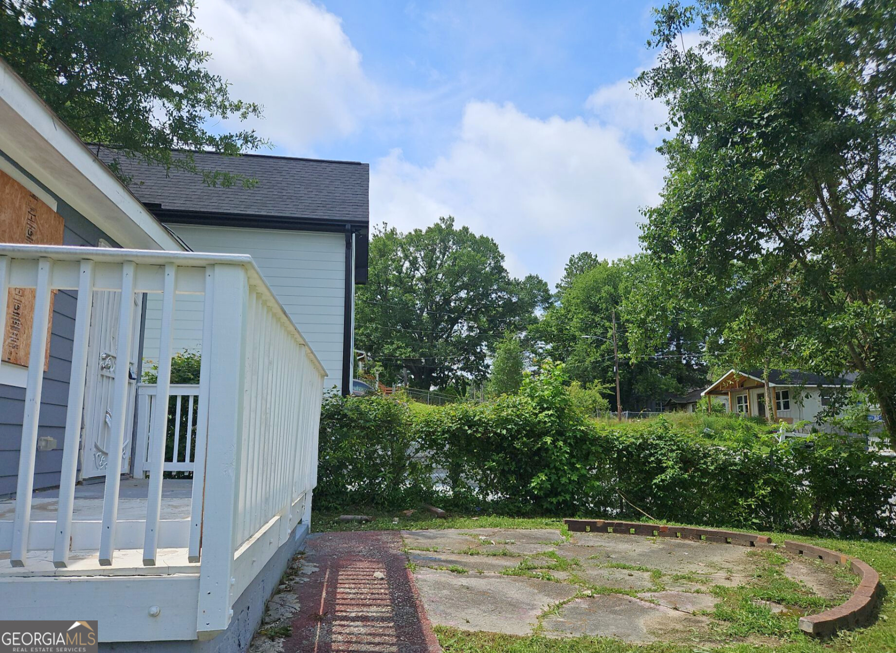 117 Dahlia Avenue Northwest Atlanta, GA 30314 - Photo 9 of 10 a backyard of a house with lots of green space