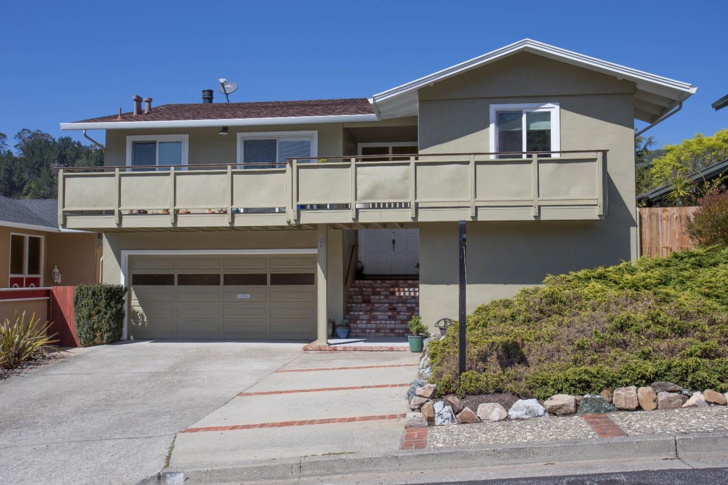 6 Pio Pico Way Pacifica, CA 94044 - Photo 1 of 17 a front view of a house with a yard garage and outdoor seating