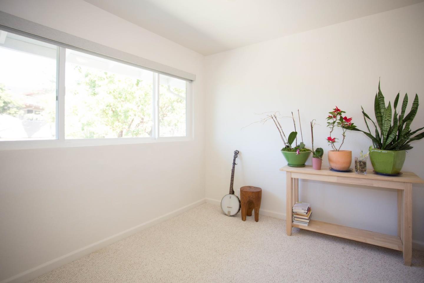 6 Pio Pico Way Pacifica, CA 94044 - Photo 6 of 17 a view of a room that has a potted plant on a counter and a window