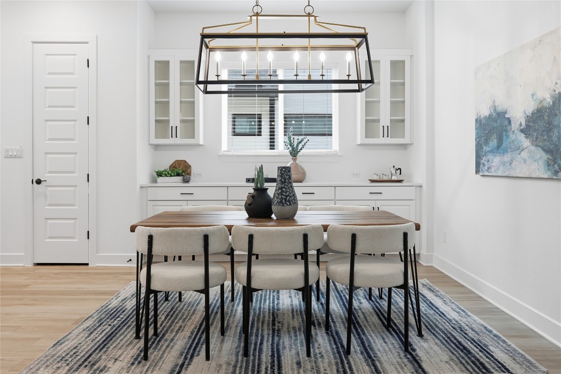 209 Springhouse Road Georgetown, TX 78628 - Photo 14 of 31 The dining room features built in cabinets for additional storage