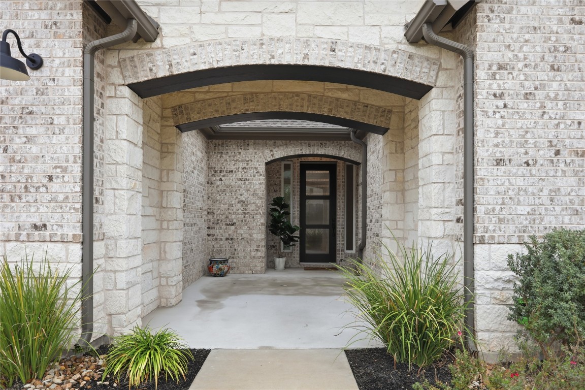 209 Springhouse Road Georgetown, TX 78628 - Photo 2 of 31 Charming courtyard-like front patio