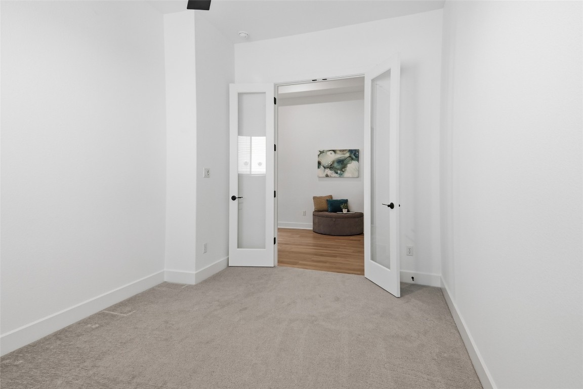 209 Springhouse Road Georgetown, TX 78628 - Photo 21 of 31 The flex room features french doors and is great as an office, music room, or TV room.