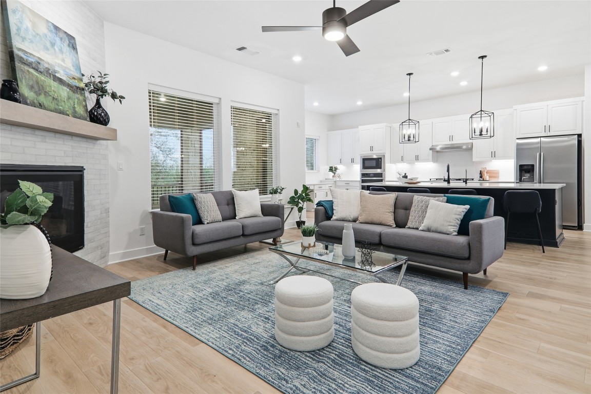209 Springhouse Road Georgetown, TX 78628 - Photo 7 of 31 Living room is open to the spacious kitchen