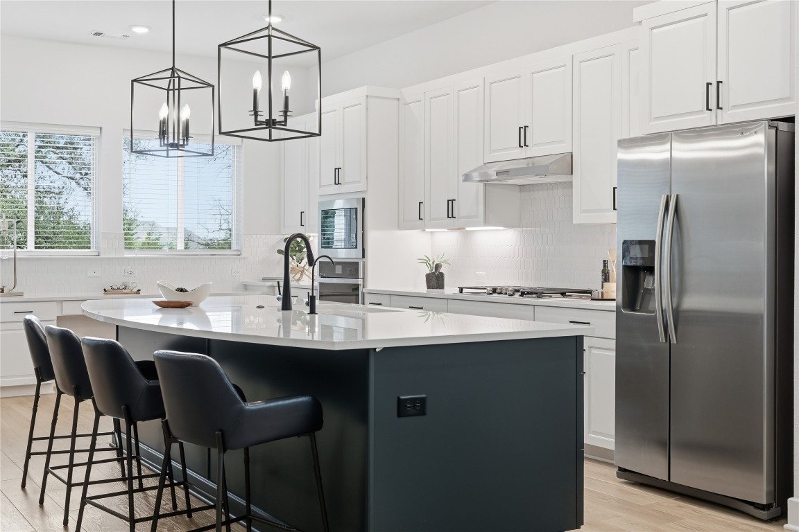 209 Springhouse Road Georgetown, TX 78628 - Photo 9 of 31 Gorgeous kitchen with desk area under the windows
