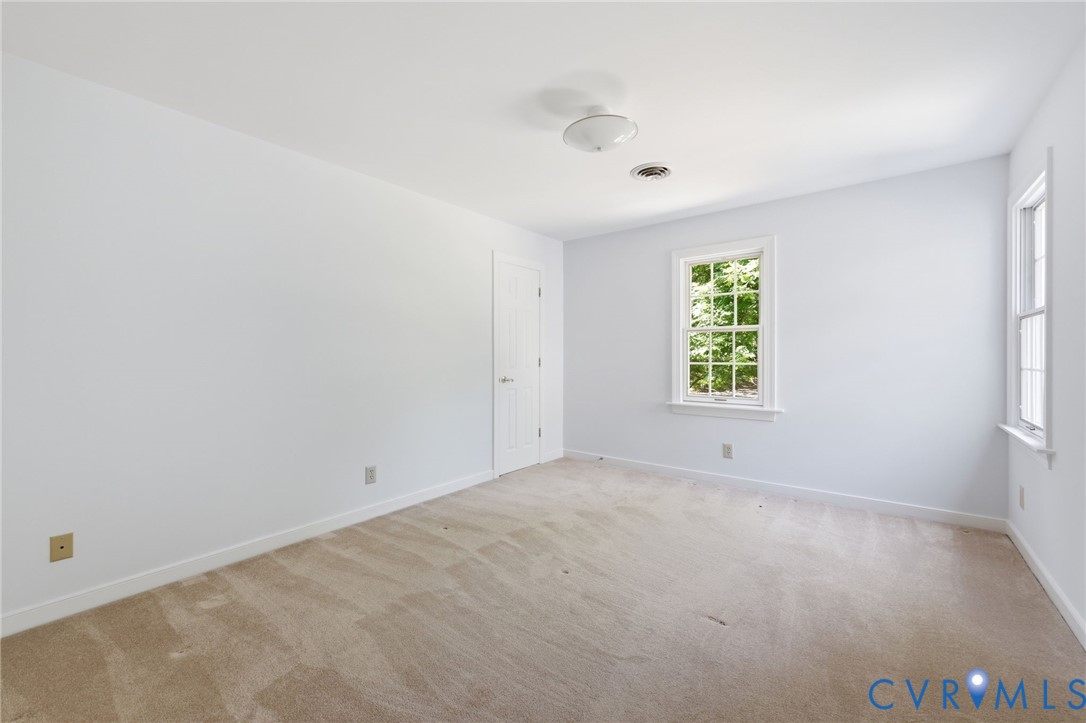 3201 East Brigstock Road Midlothian, VA 23113 - Photo 42 of 72 an empty room with windows