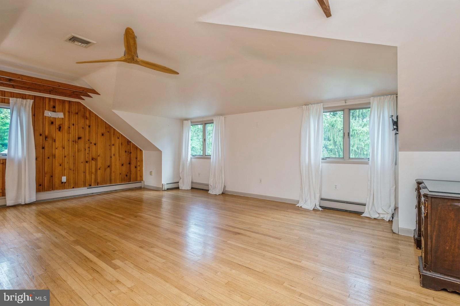 536 Rosedale Road Princeton, NJ 08540 - Photo 18 of 34 a view of an empty room with a window and wooden floor