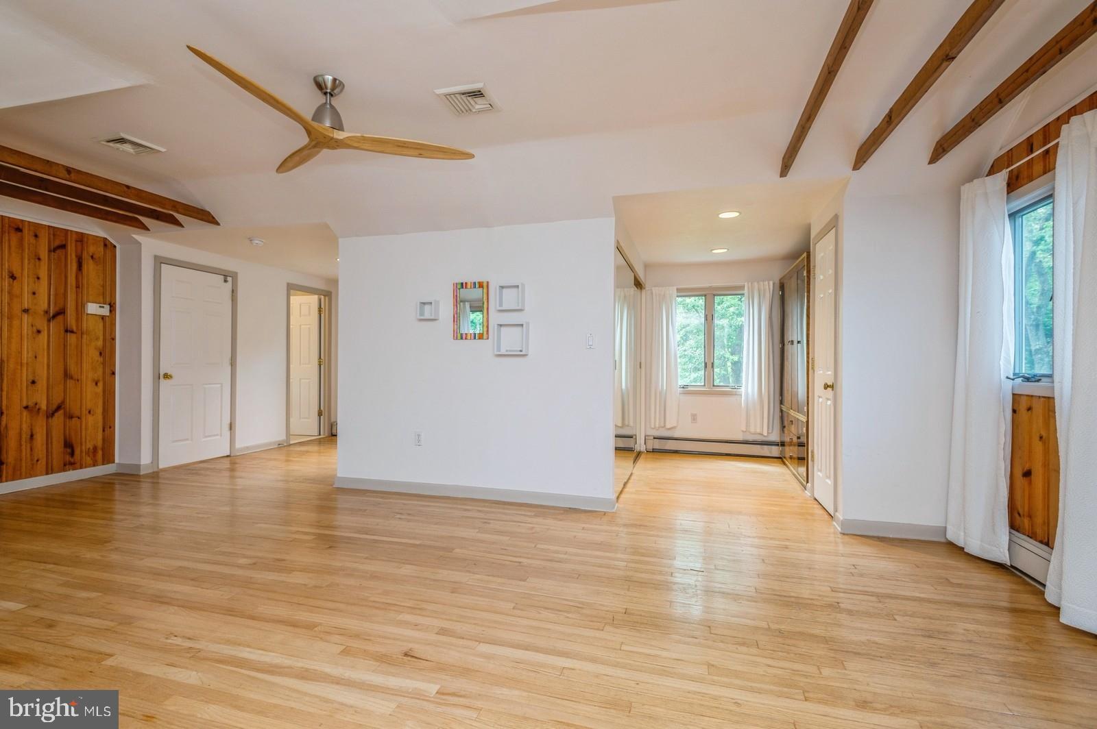 536 Rosedale Road Princeton, NJ 08540 - Photo 19 of 34 a view of an empty room with wooden floor and a window