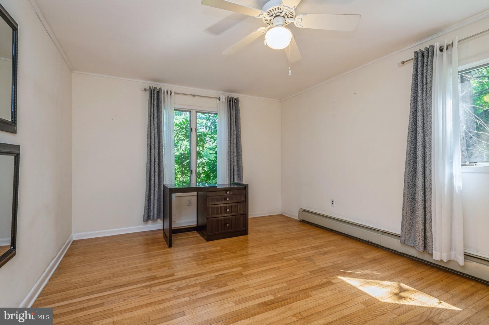 536 Rosedale Road Princeton, NJ 08540 - Photo 23 of 34 an empty room with wooden floor fan and windows