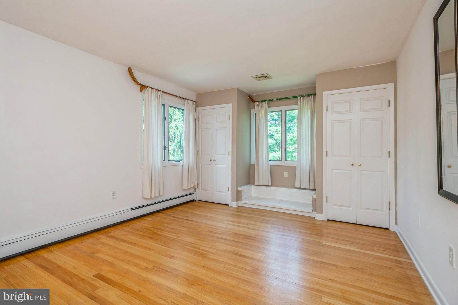536 Rosedale Road Princeton, NJ 08540 - Photo 24 of 34 an empty room with wooden floor and windows