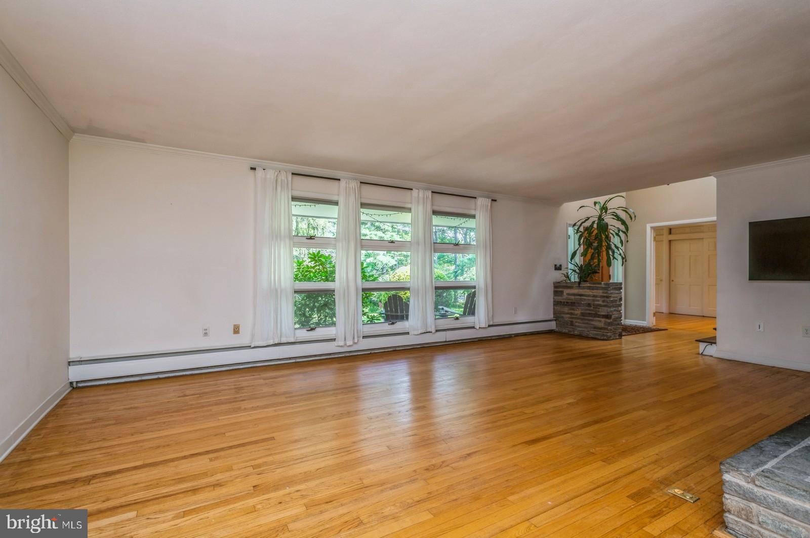 536 Rosedale Road Princeton, NJ 08540 - Photo 6 of 34 a view of empty room with wooden floor and fan