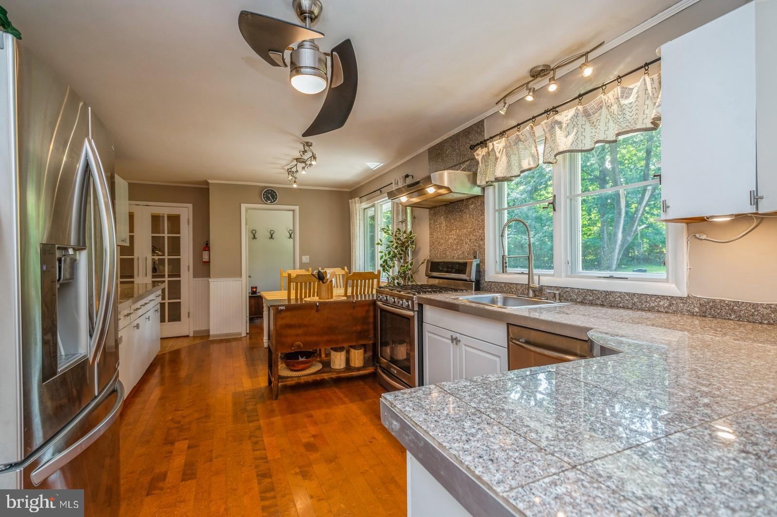 536 Rosedale Road Princeton, NJ 08540 - Photo 7 of 34 a large kitchen with kitchen island a large window in it