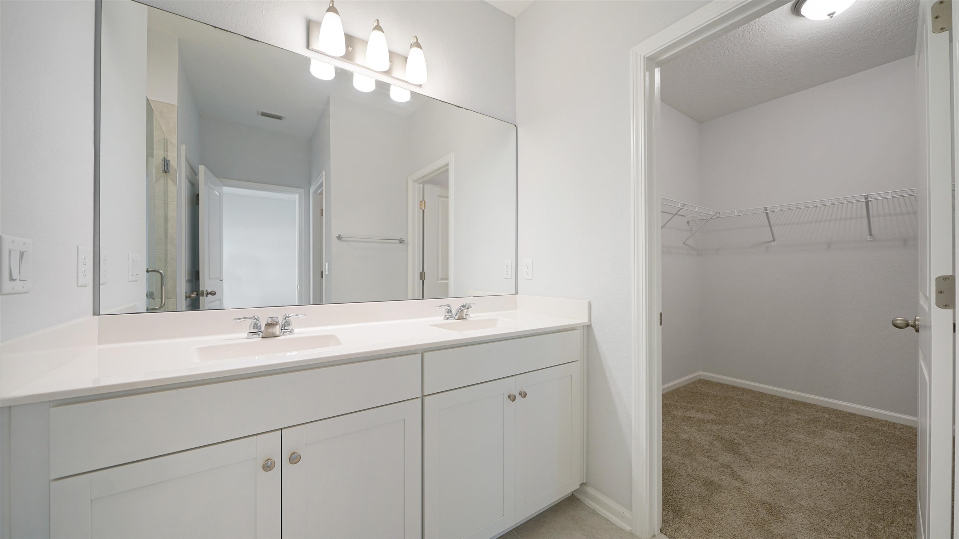 443 Watervale Drive St. Augustine, FL 32092 - Photo 13 of 39 a bathroom with a double vanity sink and a mirror