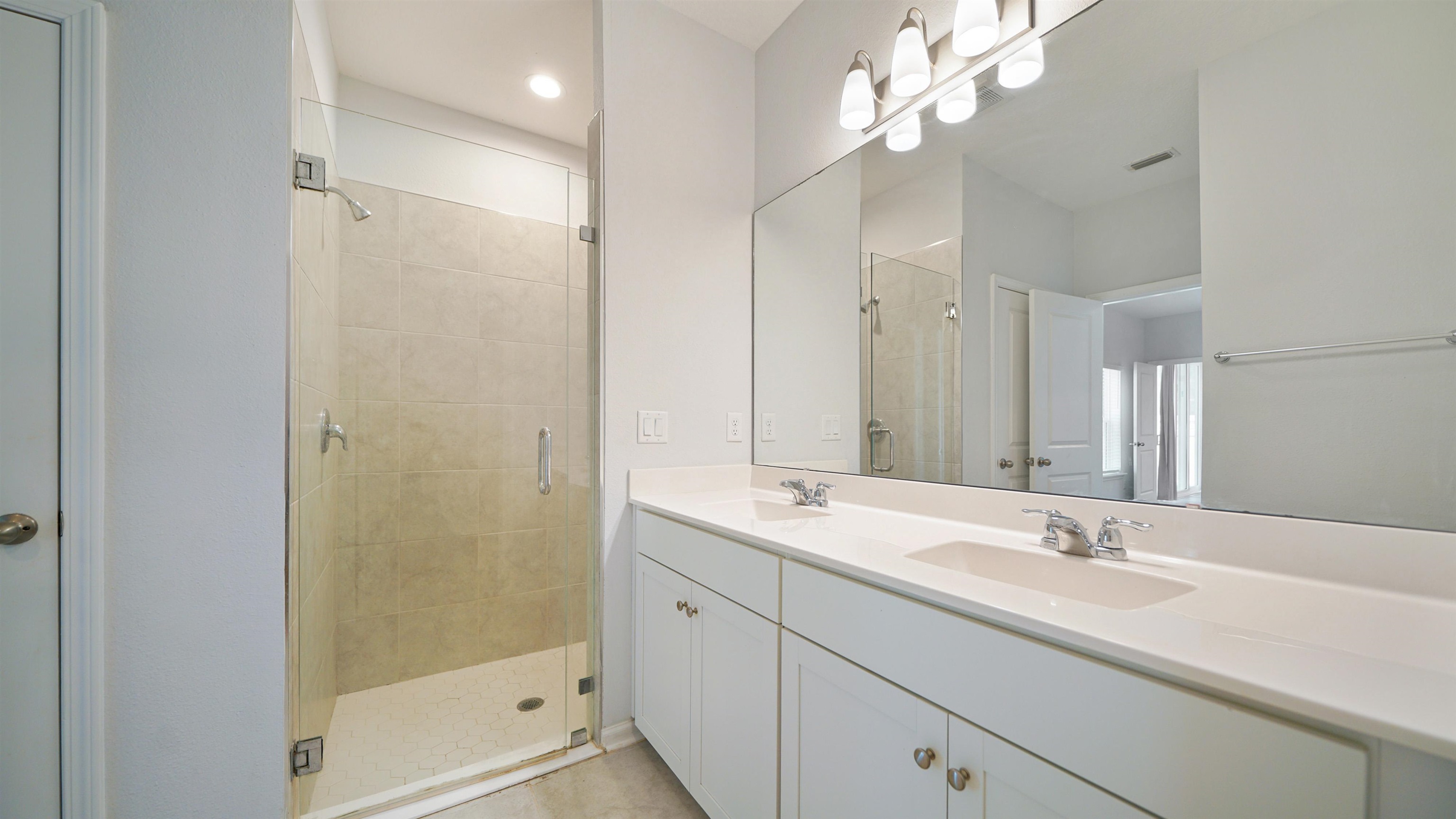 443 Watervale Drive St. Augustine, FL 32092 - Photo 14 of 39 a bathroom with a double vanity sink mirror and shower