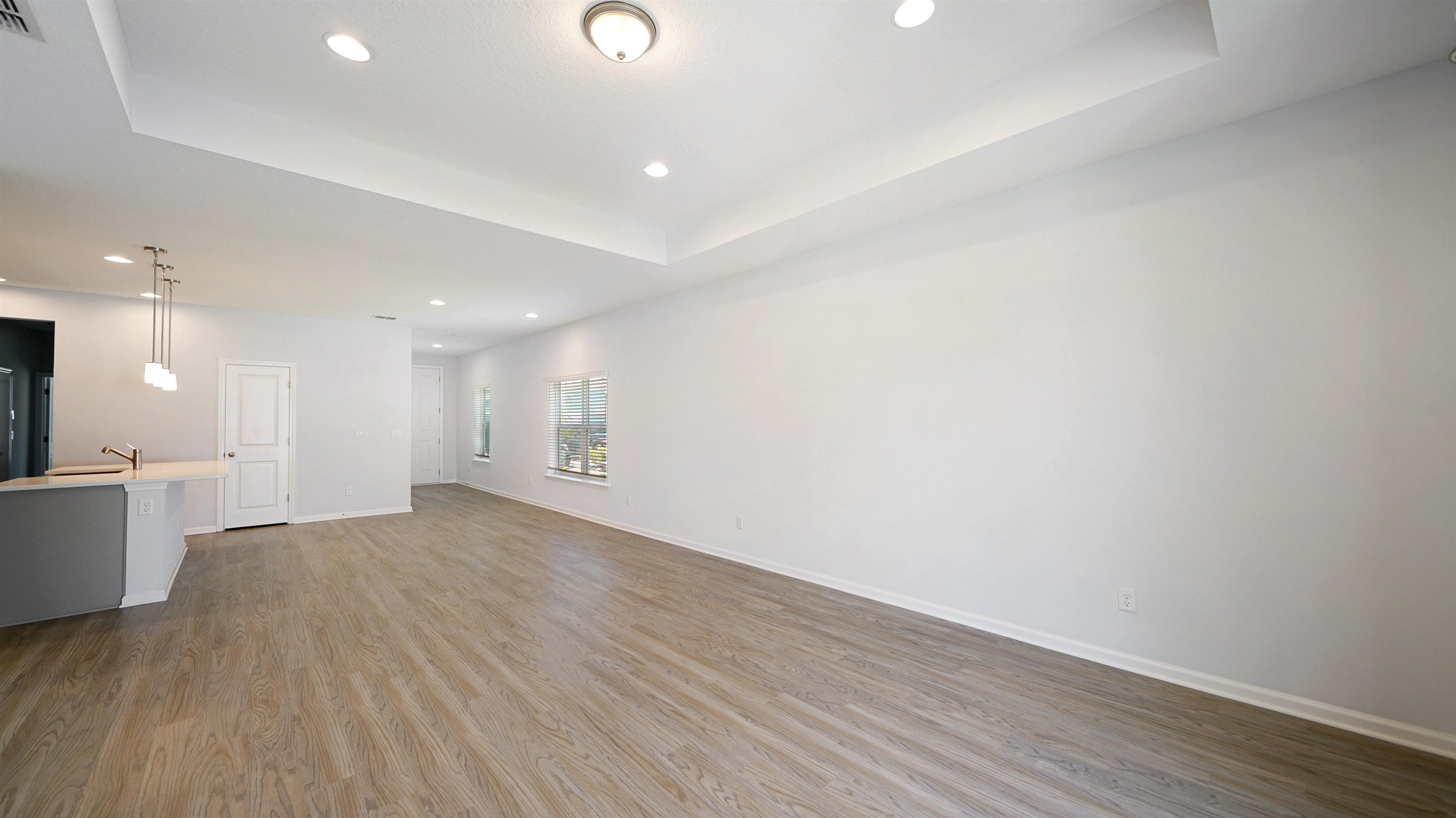 443 Watervale Drive St. Augustine, FL 32092 - Photo 15 of 39 an empty room with wooden floor and windows