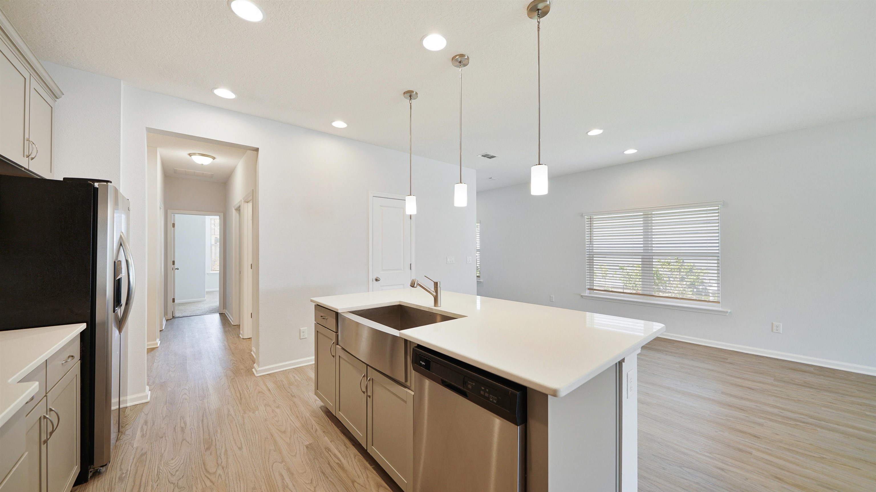 443 Watervale Drive St. Augustine, FL 32092 - Photo 16 of 39 a kitchen with a sink a counter top space stainless steel appliances and wooden floor
