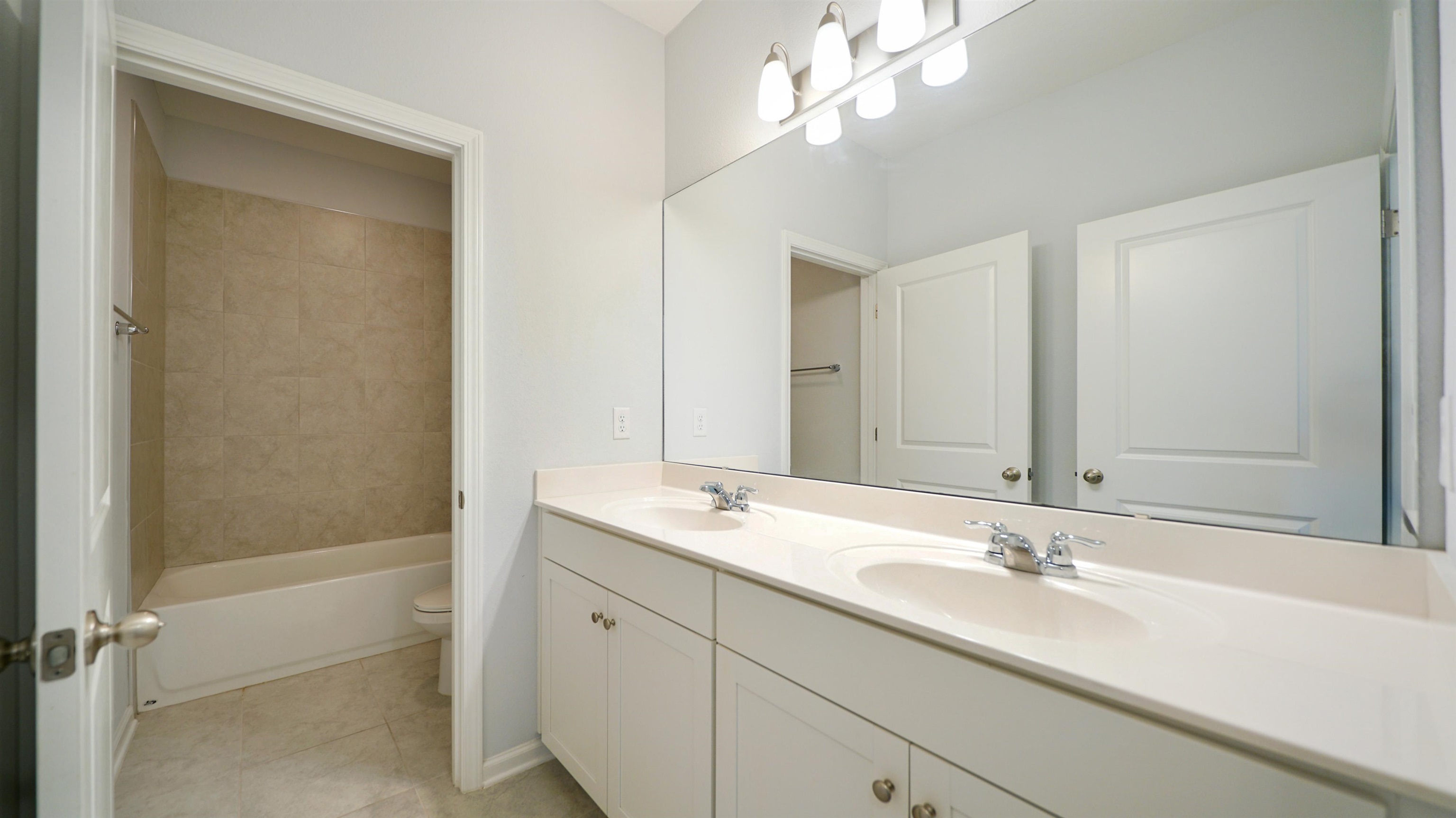 443 Watervale Drive St. Augustine, FL 32092 - Photo 21 of 39 a bathroom with a sink double vanity and a mirror