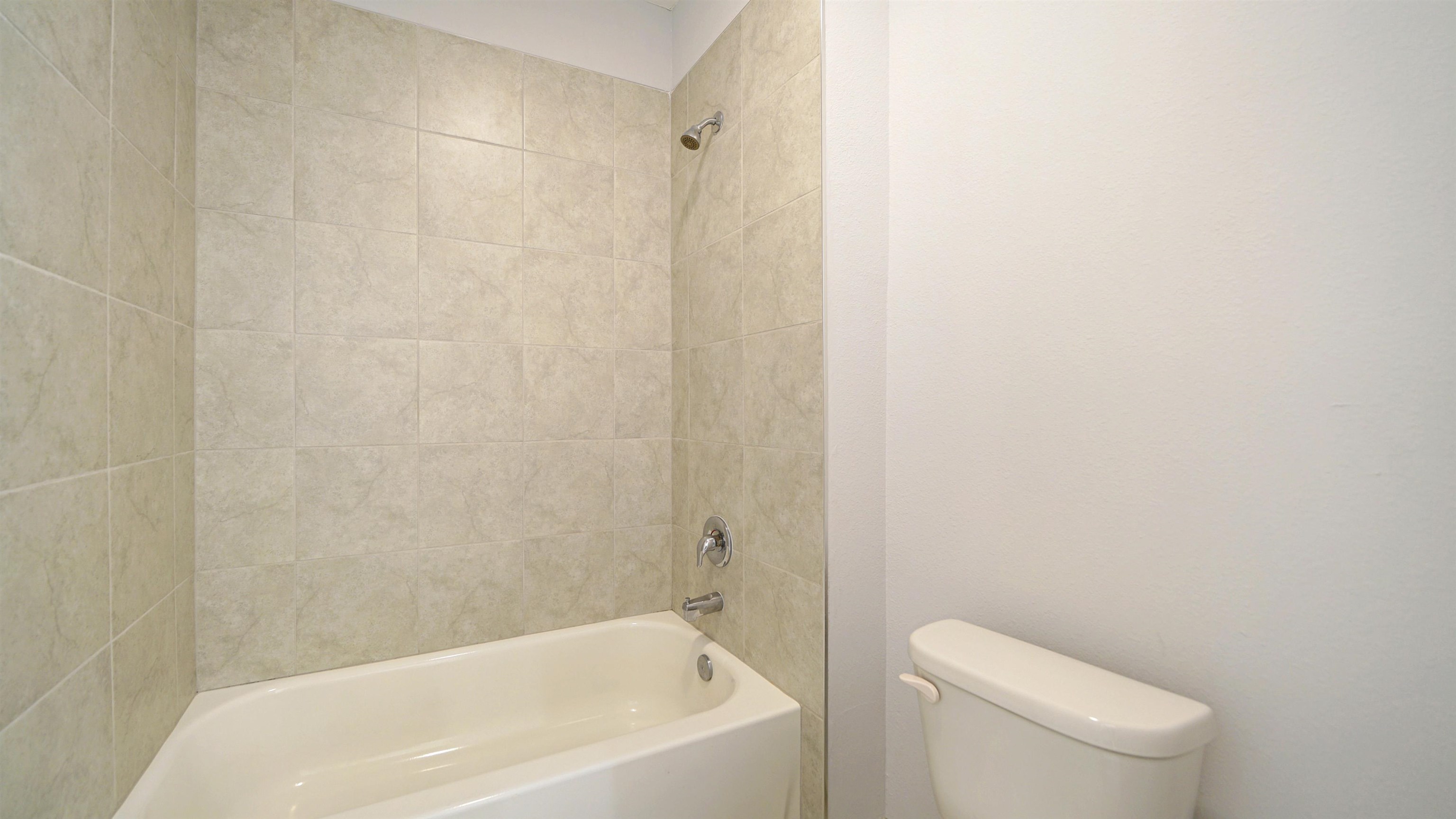 443 Watervale Drive St. Augustine, FL 32092 - Photo 22 of 39 a white bath tub sitting next to a white toilet and a shower