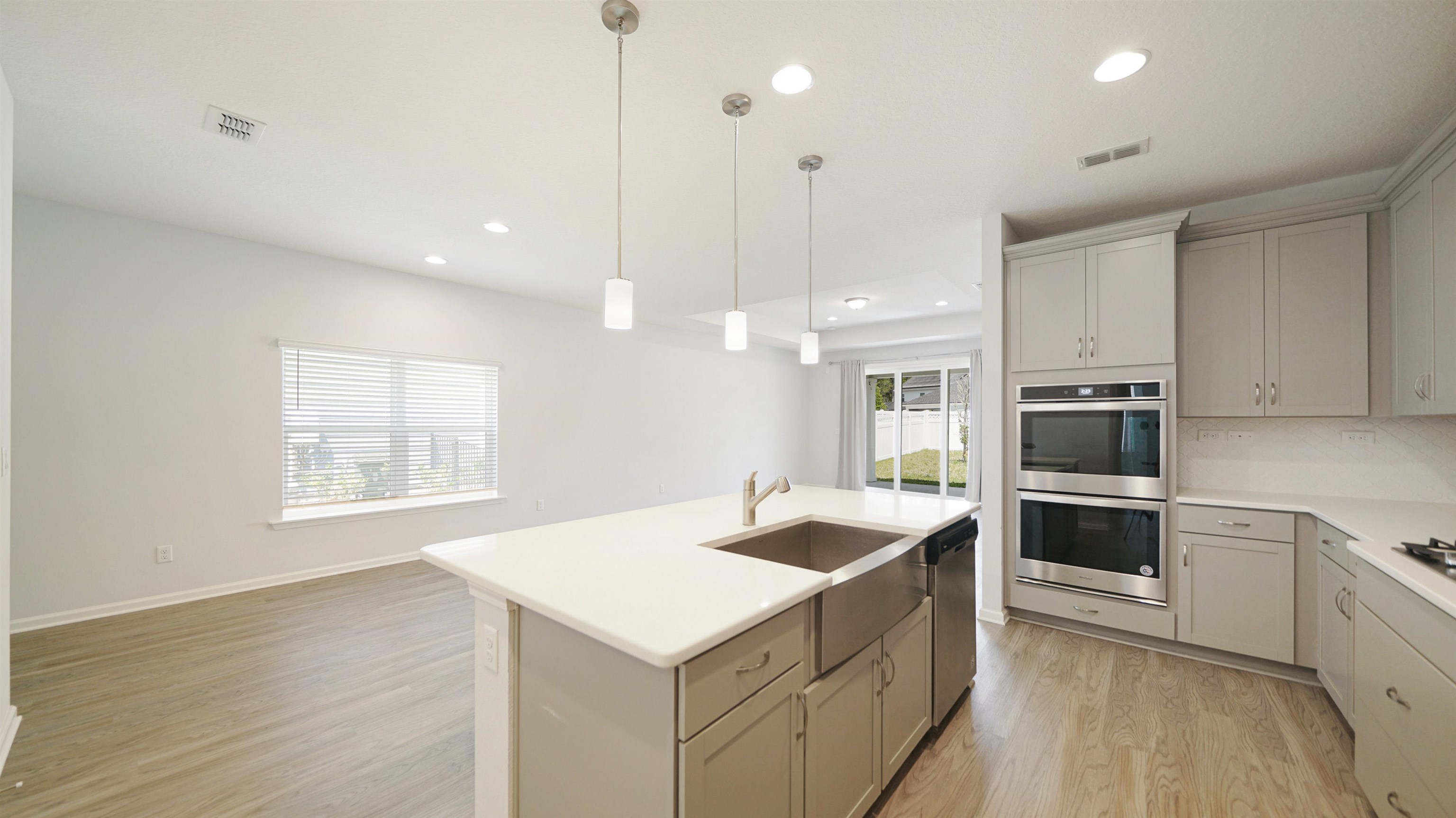443 Watervale Drive St. Augustine, FL 32092 - Photo 7 of 39 a kitchen with a sink stove and microwave