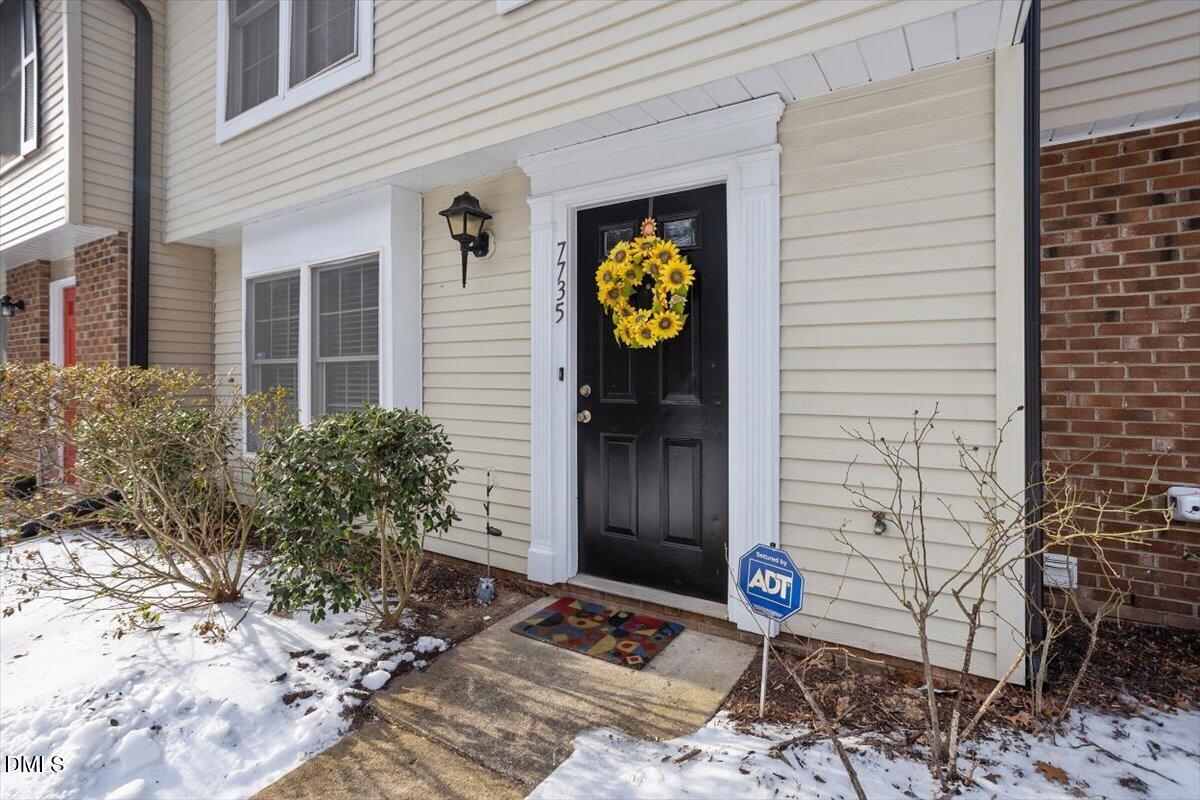 7735 Sandra Lane Raleigh, NC 27615 - Photo 19 of 20 a view of a entryway door front of house