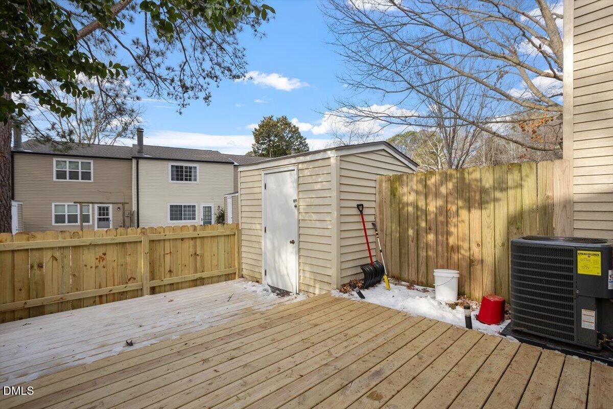 7735 Sandra Lane Raleigh, NC 27615 - Photo 2 of 20 a view of a house with wooden deck