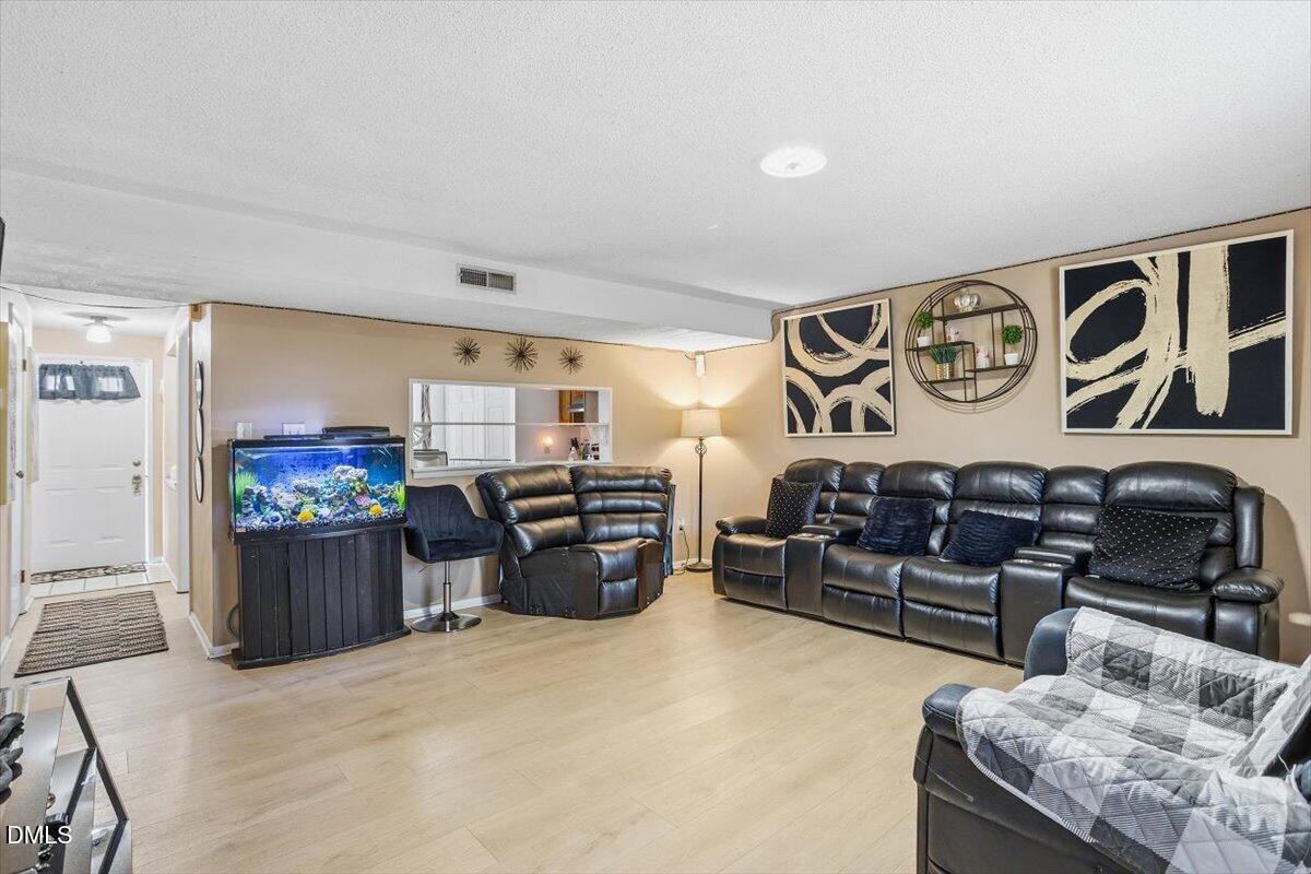 7735 Sandra Lane Raleigh, NC 27615 - Photo 3 of 20 a bedroom with furniture and window