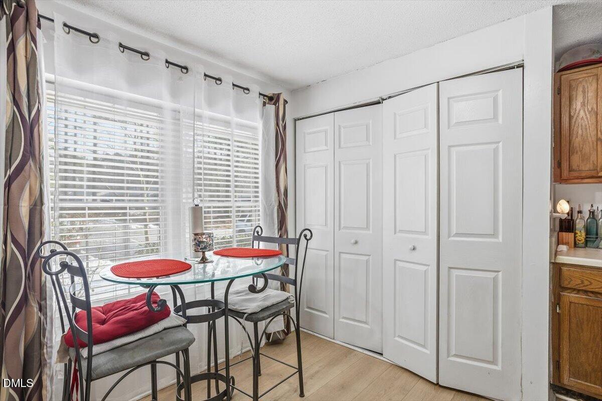 7735 Sandra Lane Raleigh, NC 27615 - Photo 10 of 20 a table and chairs in a room