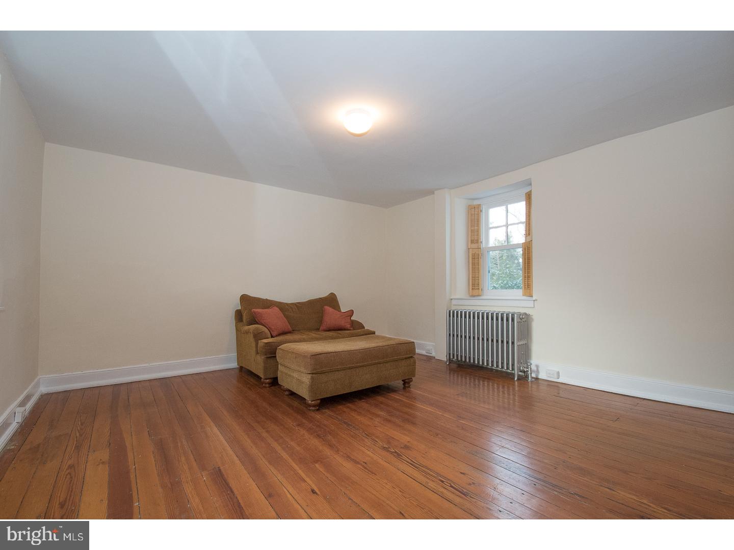 929 Merion Square Road Gladwyne, PA 19035 - Photo 8 of 25 a room with a chair and a window