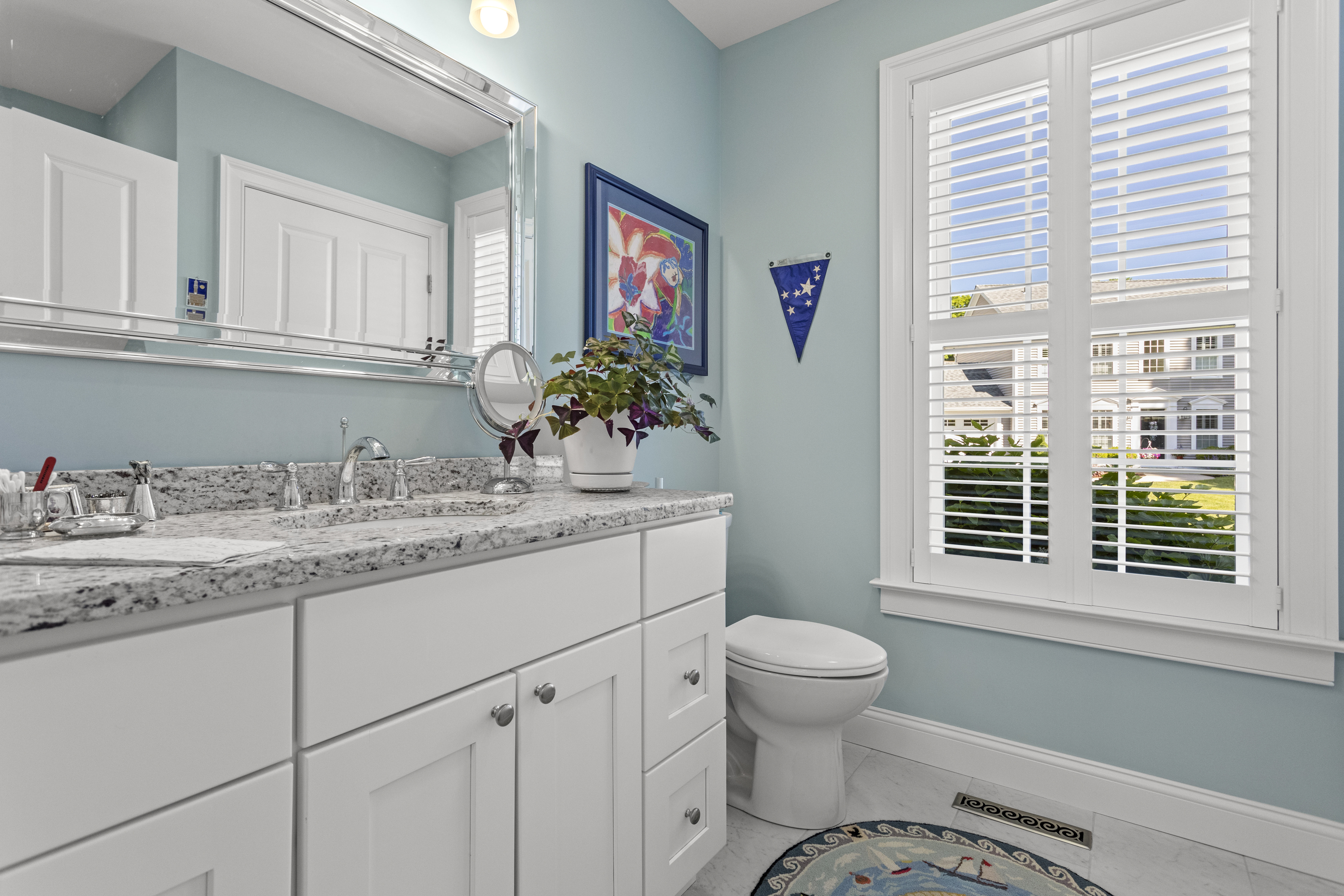 951 Old Clinton Road, Unit 15 Westbrook, CT 06498 - Photo 12 of 30 a bathroom with a granite countertop sink mirror vanity and next to a window