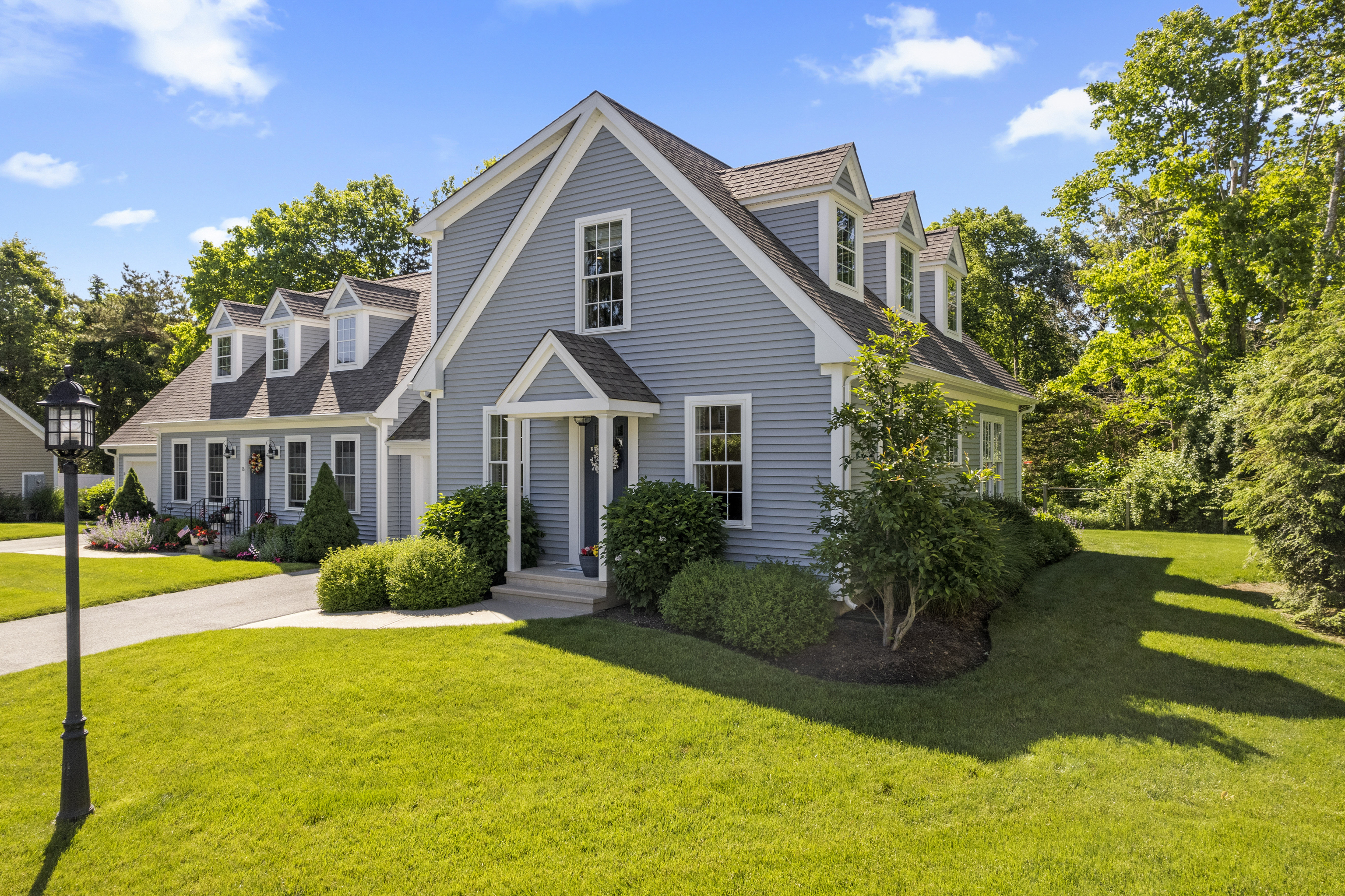 951 Old Clinton Road, Unit 15 Westbrook, CT 06498 - Photo 23 of 30 a front view of a house with a yard