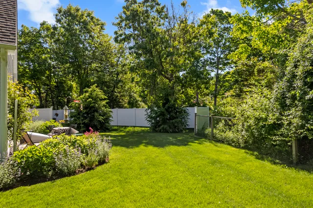 a view of backyard with swimming pool
