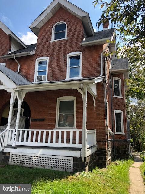 102 West Broad Street, Unit 1 Souderton, PA 18964 - Photo 1 of 20 a front view of a house with a yard