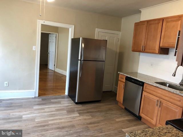 102 West Broad Street, Unit 1 Souderton, PA 18964 - Photo 12 of 20 a kitchen with a refrigerator cabinet and cabinets