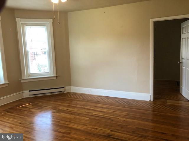 102 West Broad Street, Unit 1 Souderton, PA 18964 - Photo 8 of 20 an empty room with wooden floor and windows