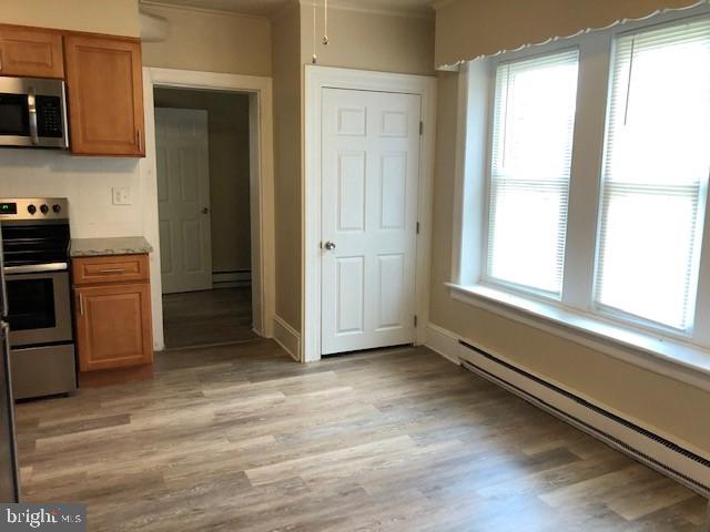 102 West Broad Street, Unit 1 Souderton, PA 18964 - Photo 10 of 20 a view of an empty room and a kitchen
