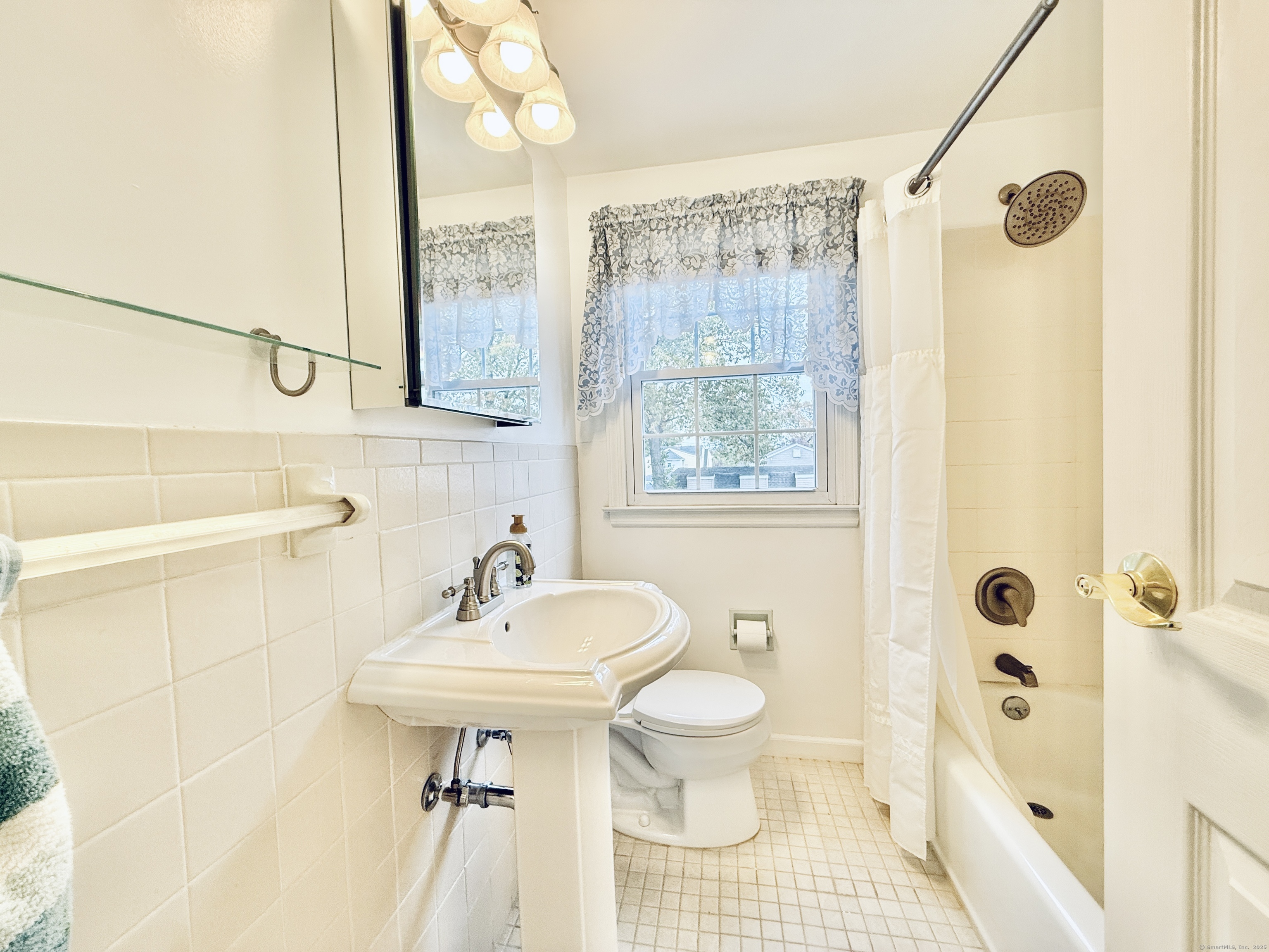 171 Sylvan Knoll Road Stamford, CT 06902 - Photo 15 of 23 a bathroom with a sink a toilet and shower
