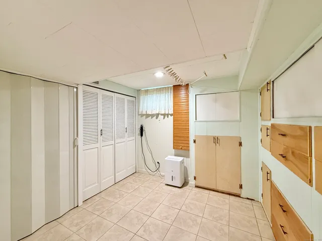 a view of a kitchen with refrigerator and microwave