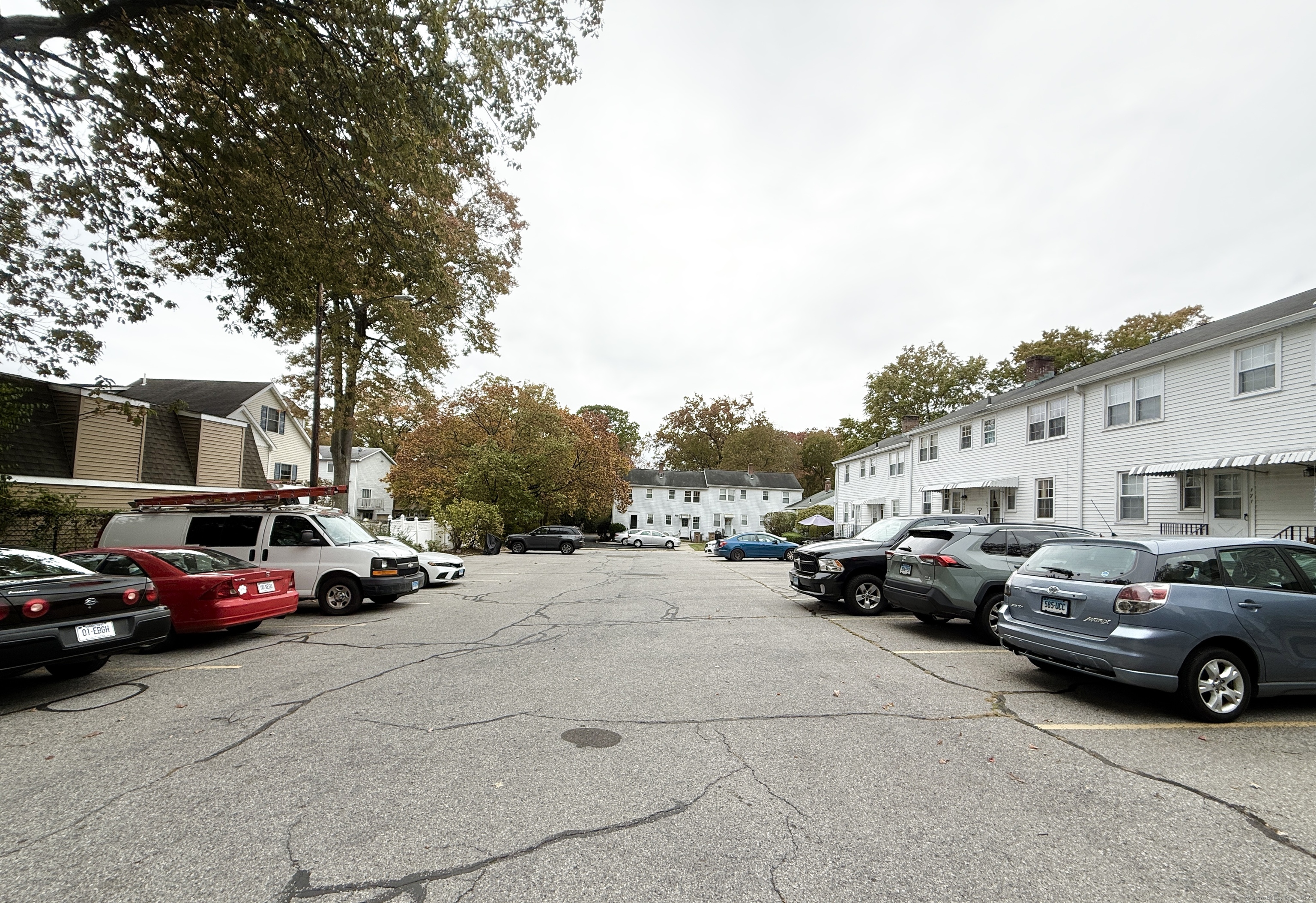 171 Sylvan Knoll Road Stamford, CT 06902 - Photo 23 of 23 a view of cars parked in front of a house