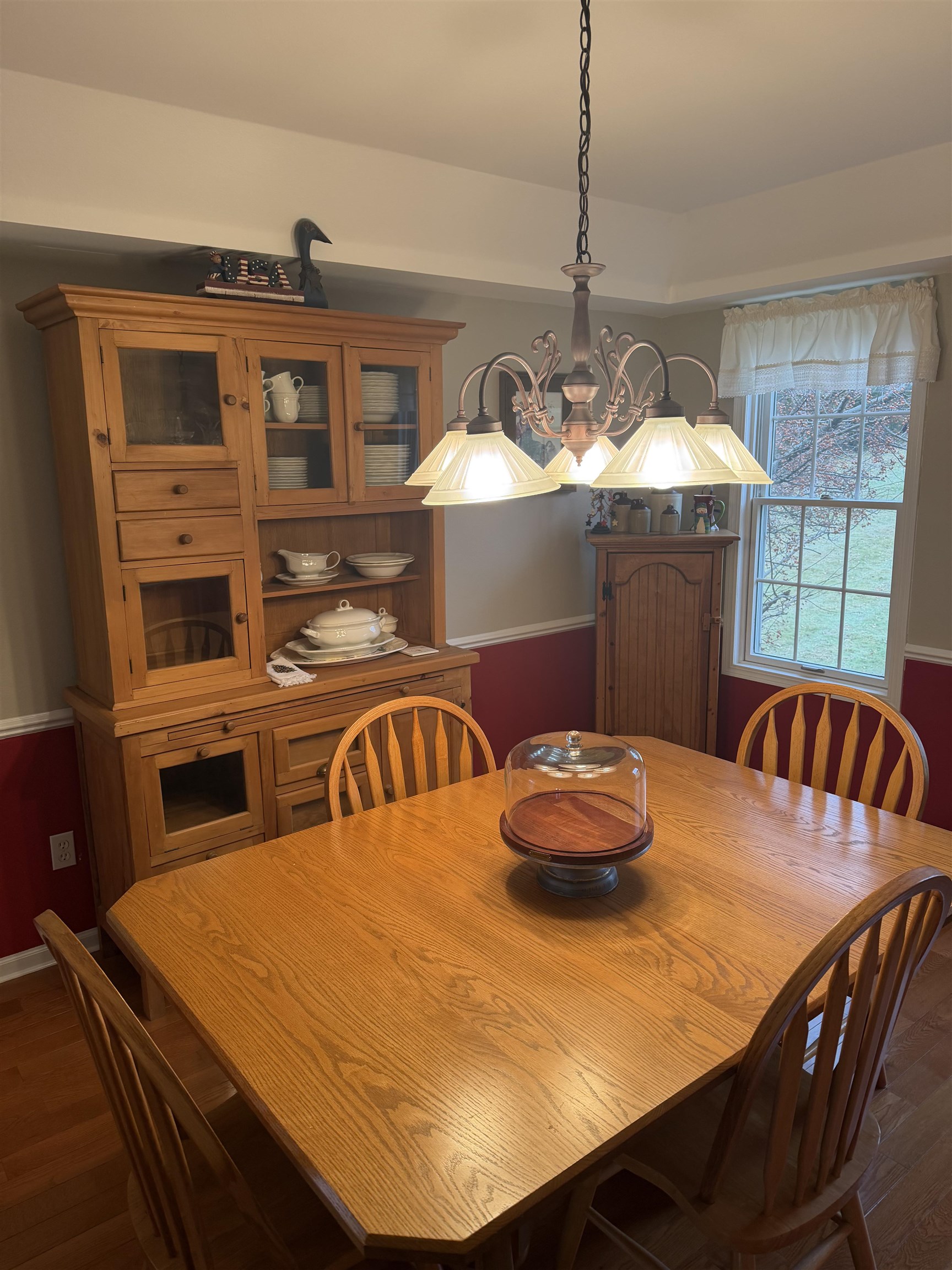 5206 East Hubbard Trail Byron, IL 61010 - Photo 11 of 52 a kitchen with a table chairs and wooden floor