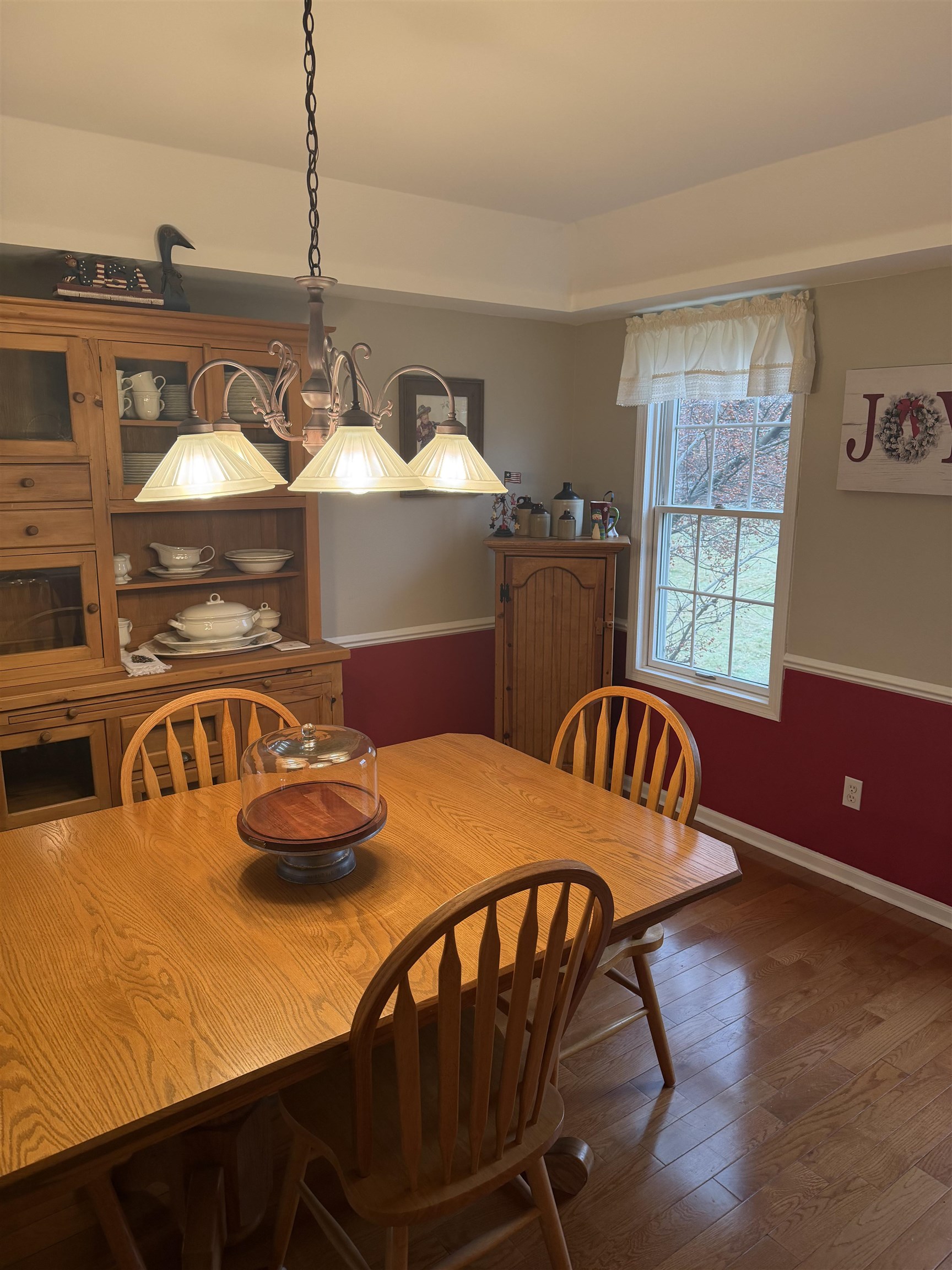 5206 East Hubbard Trail Byron, IL 61010 - Photo 17 of 52 a view of a dining room with furniture window and wooden floor
